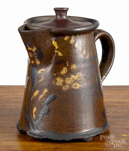 Redware teapot, early 19th c., possibly Moravian, with slip floral decoration, 7'' h.