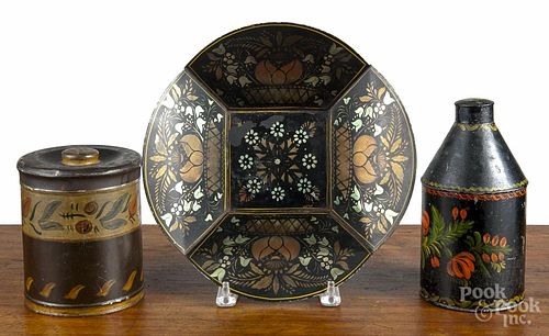 Toleware tea caddy, 19th c., with later decoration, 8'' h., together with a stenciled bread tray