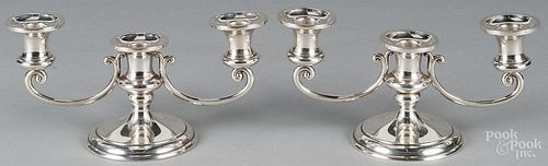 Pair of sterling silver candelabra, 4 3/4'' h., 10'' w., 31.6 ozt.