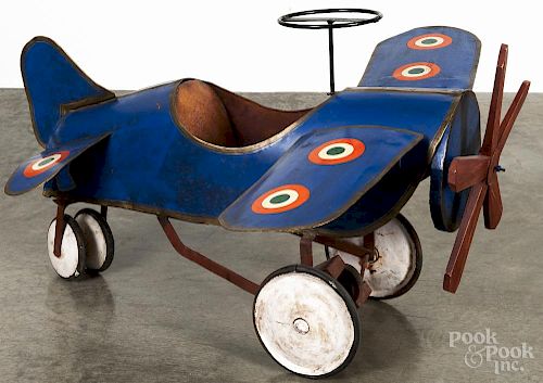 Pressed steel monoplane pedal car, ca. 1940, having removable wings, a leather seat