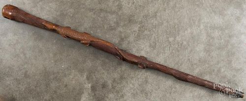 Carved folk art cane, ca. 1900, with a large relief of alligators, 35'' l.