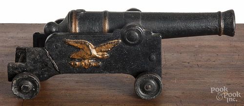 Cast iron toy cannon, 19th c., with embossed eagle, barrel - 8 1/2'' l.