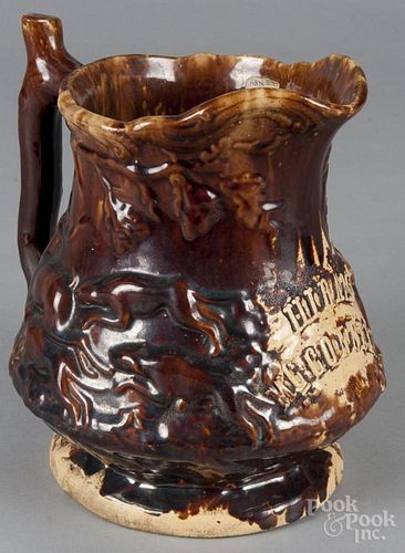 Rockingham glaze yellowware pitcher, 19th c., with relief hunt scene, inscribed Hiram McConnell