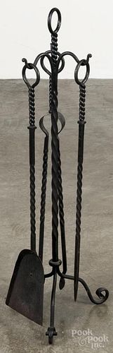 Wrought iron fireplace set, to include andirons, 24'' h.