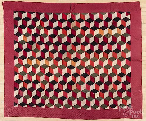 Pieced Baby Block pattern hand-sewn quilt, likely Amish or Mennonite, with floral pattern backing