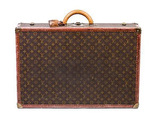 * A Louis Vuitton Hardsided Suitcase, 27.5" x 18.5" x 7".