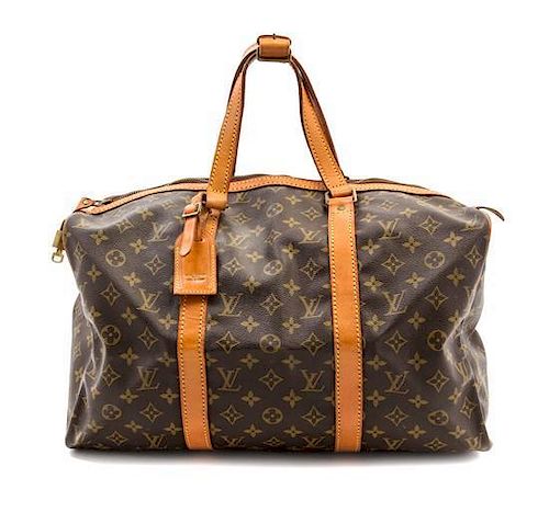 A Louis Vuitton Monogram Canvas Small Duffle Bag, 8.5 x 17.25 x 10. sold  at auction on 7th October