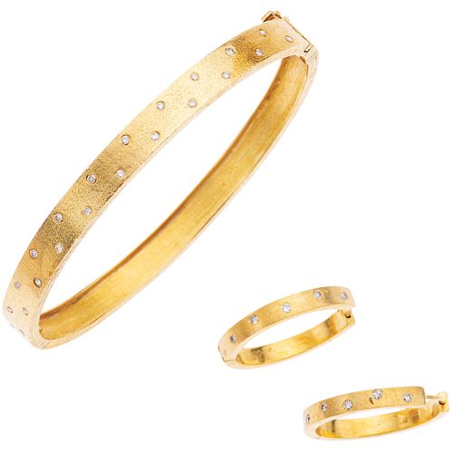 SET OF BRACELET AND PAIR OF EARRINGS WITH DIAMONDS IN 18K YELLOW GOLD Bracelet with box clasp and 8-shaped safety.