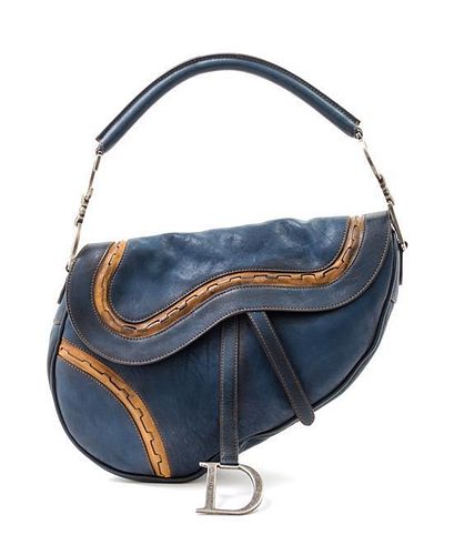 * A Christian Dior Blue Leather Saddle Handbag,