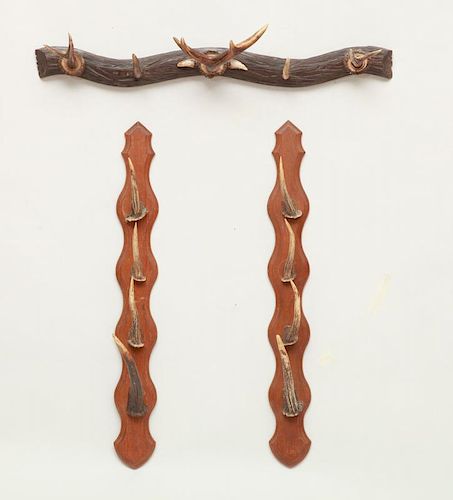 PAIR OF ANTLER AND STAINED OAK HAT RACKS