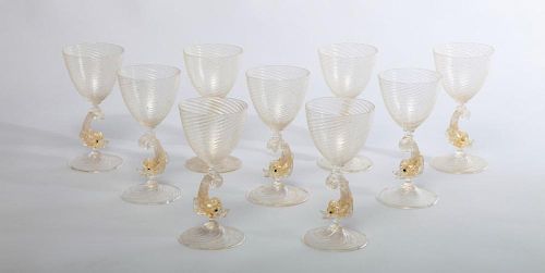 SET OF NINE VENETIAN GOLD FLECKED GLASS DOLPHIN-FORM WINE GLASSES