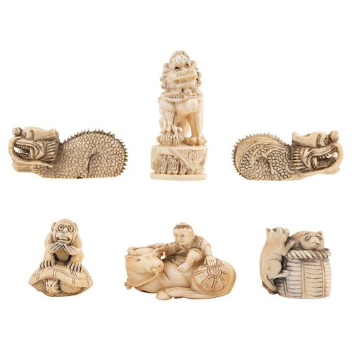 GROUP OF NETSUKE FIGURES JAPAN, EARLY 20TH CENTURY Carved in ivory Some signed Includes Fu dogs an dragons 2.1" (5.5 cm)