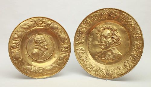 TWO CONTINENTAL REPOUSSÉ BRASS PORTRAIT CHARGERS, VAN DYCK AND HENRY IV