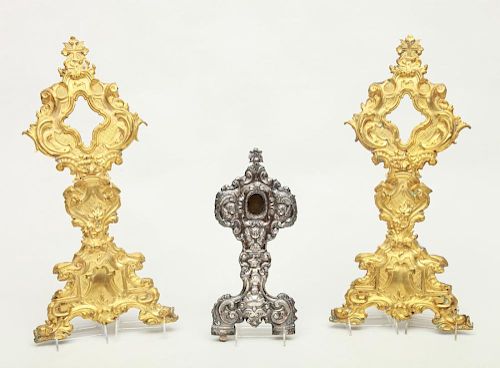 ITALIAN BAROQUE REPOUSSÉ SILVER ON WOOD RELIQUARY AND A PAIR OF ITALIAN BAROQUE STYLE REPOUSSÉ BRASS RELIQUARY FRONTS