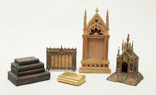 TWO GOTHIC REVIVAL BRASS FRAMES AND A GOTHIC REVIVAL CHAPEL-FORM CANDLE HOLDER