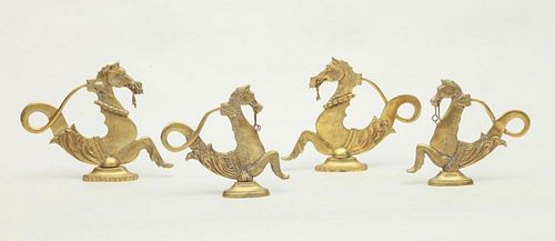 TWO PAIRS OF BRASS SEAHORSE FORM DOOR STOPS