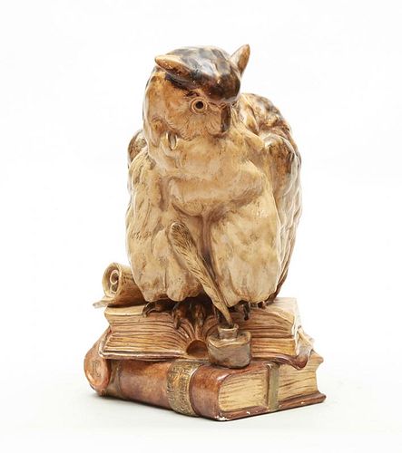 GERMAN GLAZED POTTERY MODEL OF AN OWL RESTING ON A STACK OF BOOKS