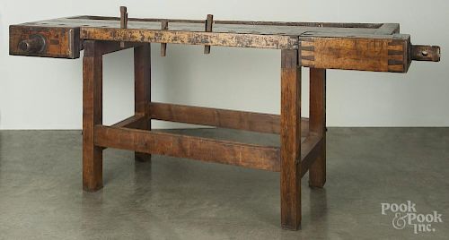 Large wooden work bench, ca. 1900, with several iron stops, 35'' h., 79 1/2'' w., 25'' d.