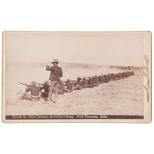 [BUFFALO SOLDIERS]. MILLER, Andrew, photographer. Boudoir photograph of Lt. Powhatan H. Clarke and Troop K, 10th Cavalry at volley-firing. Fort Thomas