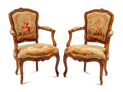 A Pair of Louis XV Tapestry-Upholstered Walnut Fauteuils