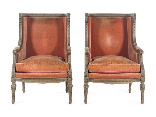 A Pair of Louis XVI Carved and Painted Walnut Bergeres a L'Oreilles
