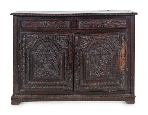 A Renaissance Style Carved Walnut Cabinet