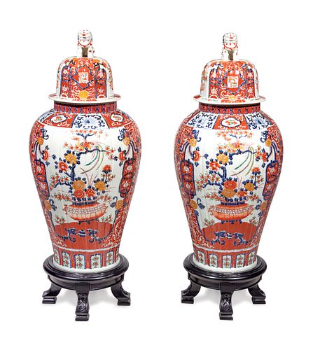 A Pair of Large Imari Palette Porcelain Jars with Wood Stands