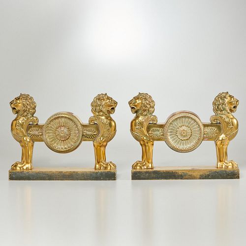 Pair Regency brass double lion firedogs