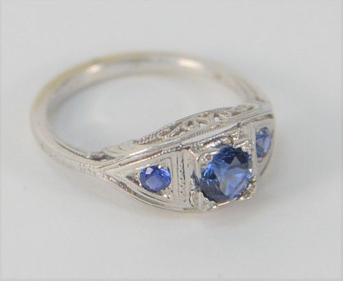 18 Karat White Gold Ring, set with three blue sapphires, center approximately .50 carats, size 5 1/2.