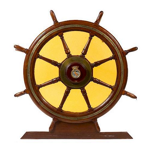 * An Ornamental Brass Mounted Oak Ship's Wheel Diameter 53 7/8 inches.