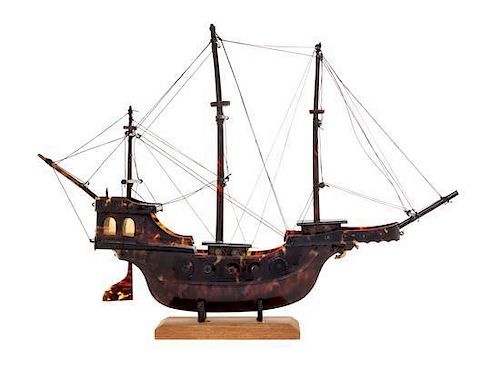 A Hand Carved Tortoise Shell Model of a Ship Width 13 3/4 inches.
