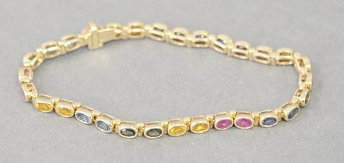 14 Karat Ladies Bracelet, having colored stones. 11 grams. 