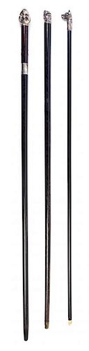* A Group of Silver Handled Walking Sticks Length of longest 36 1/2 inches.