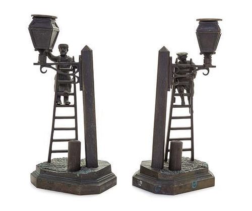A Pair of Russian Bronze Figural Candlesticks Height 10 1/4 inches.