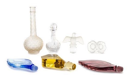 * A Collection of Perfume Bottles and Stoppers Height of tallest 6 1/2 inches.