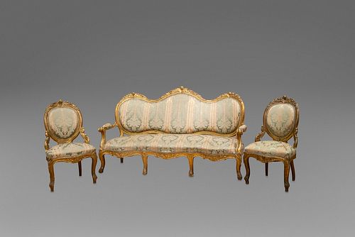 Eight armchairs and a three-seater sofa in carved and gilded wood, with plant motifs and scrolls, 19th century