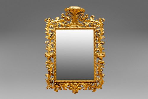 Large mirror in richly carved and gilded wood, 19th century