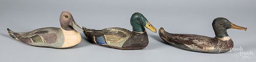 Three painted canvas duck decoys, 20th c.