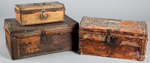 Three hide covered boxes