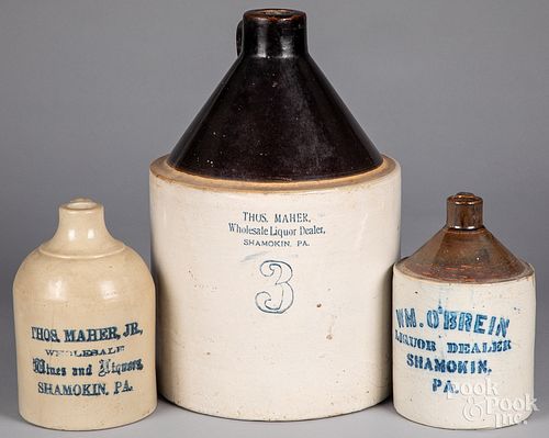 Three Pennsylvania stoneware advertising jugs
