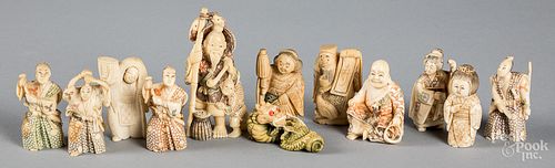 Twelve Japanese carved bone netsuke.