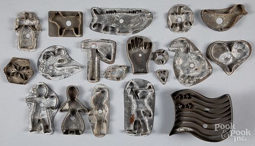 Collection of antique tin cookie cutters.