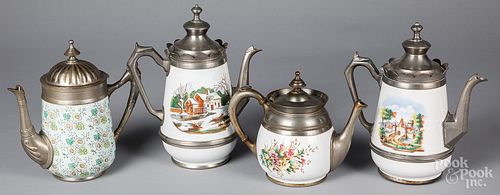 Four graniteware tea and coffee pots