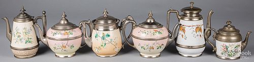 Six graniteware tea and coffee pots