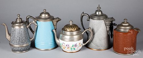 Five graniteware tea and coffee pots