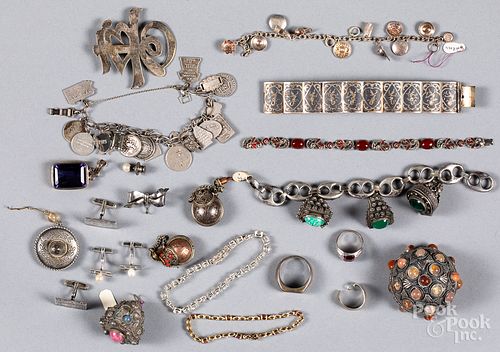 Group of jewelry, mostly silver.
