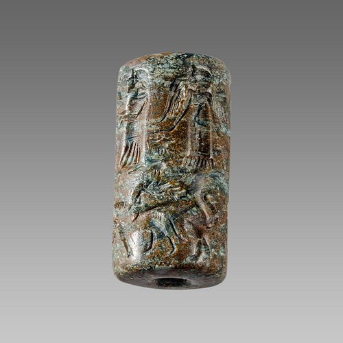 Near Eastern Style Cylinder Seal with figures and animals. 