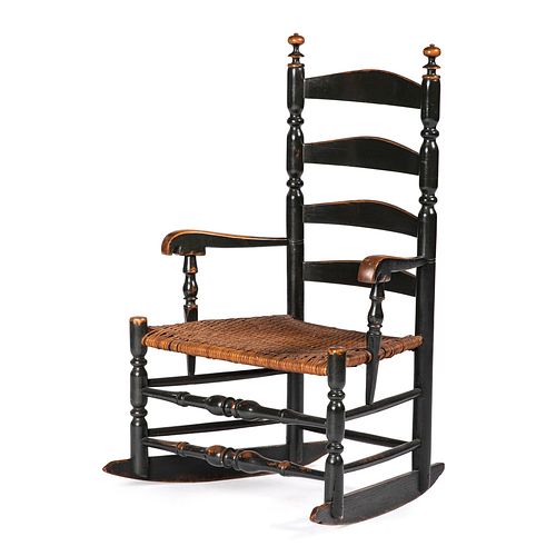 A William and Mary Black-Painted and Turned Ladderback Rocking Armchair