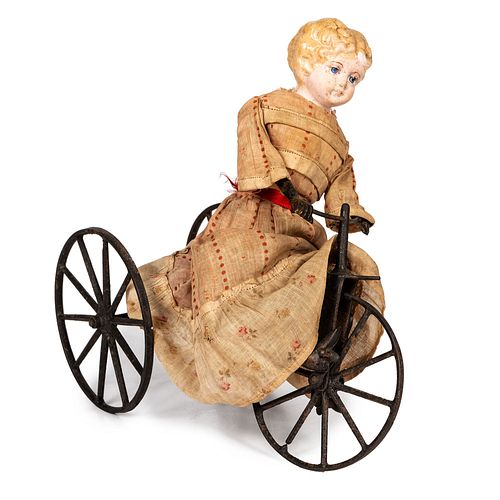 A Cast Iron and Composition Girl on Velocipede Toy