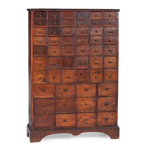 A Country Stained Pine and Cherrywood 54-Drawer Apothecary Chest